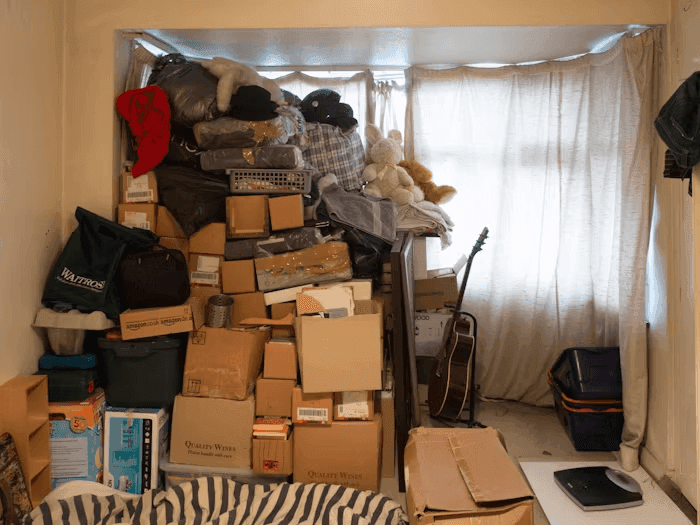 A messy, cluttered home with things piled up.png